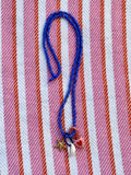 Blue beaded kjede med "Three is a charm"